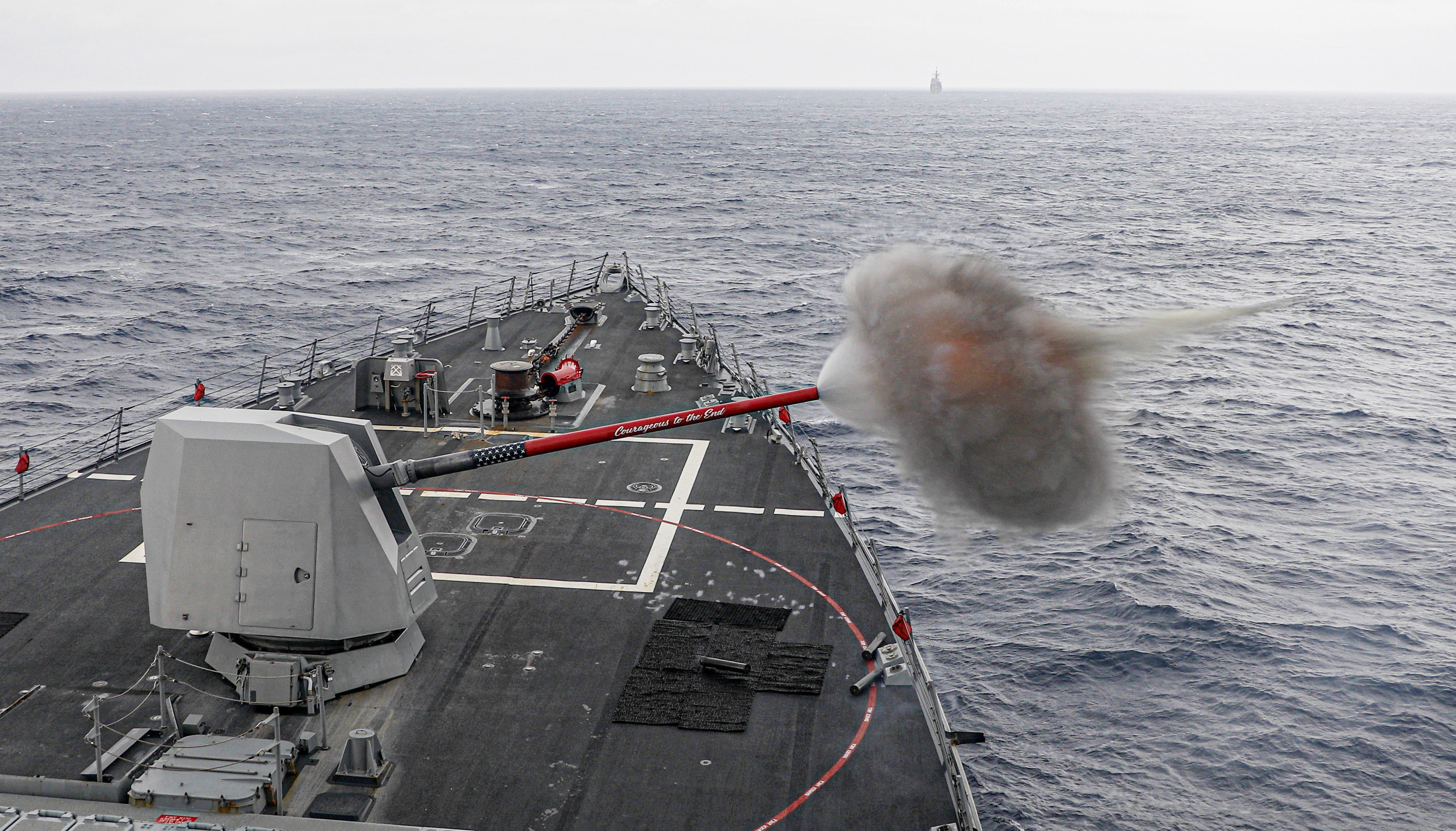 The Arleigh Burke-class guided-missile destroyer USS Rafael Peralta (DDG 115) fires the Mark 45 5-inch light-weight gun while operating in the Philippine Sea, Jan. 15.