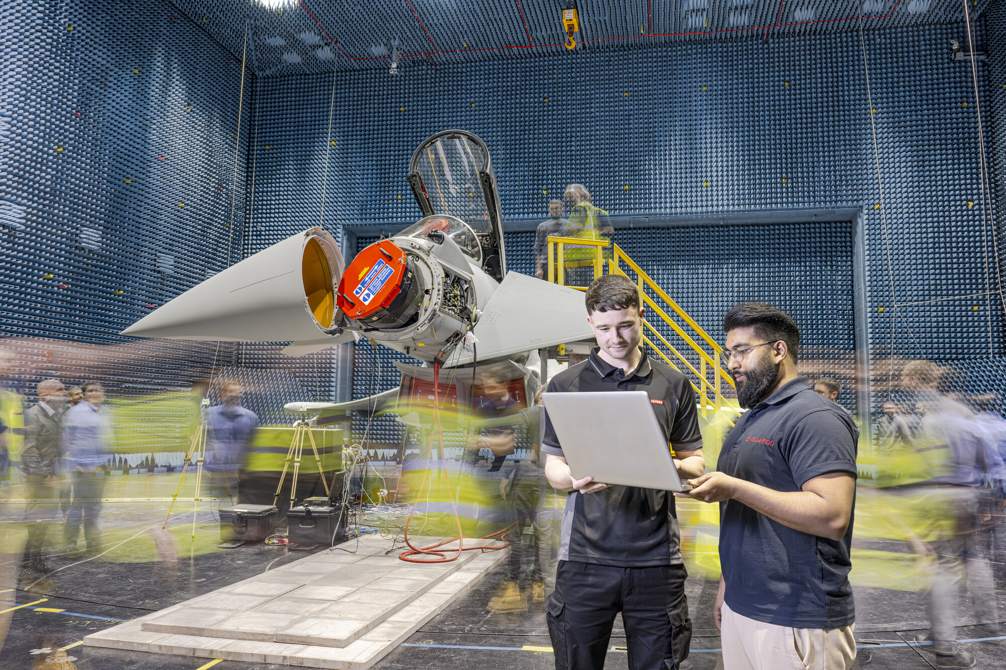 BAE Systems and Leonardo UK employees working together on the ECRS Mk2 radar installation on to a Typhoon jet