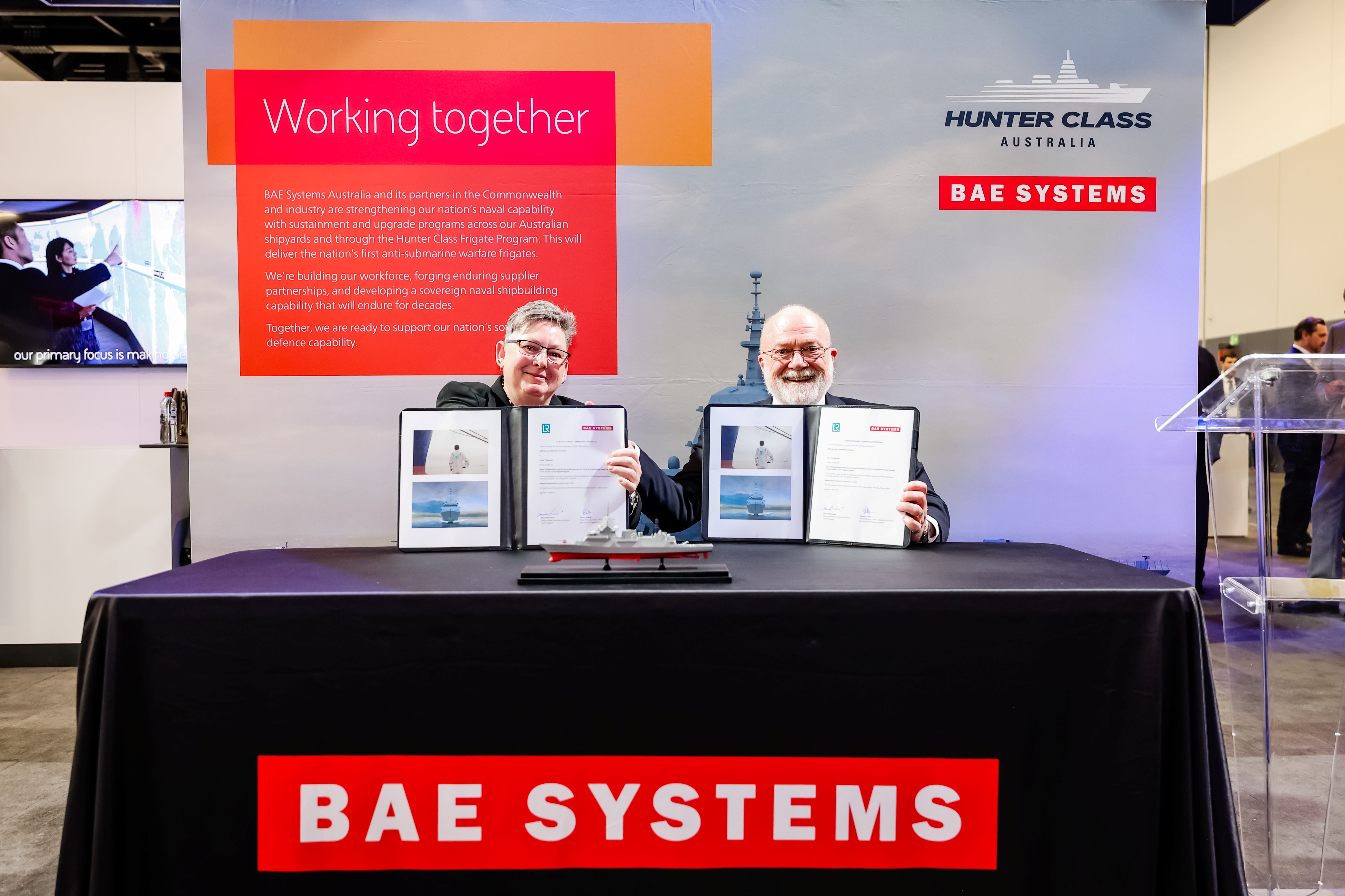 Contract signing photo of Tracey Clavell, Head of Supply Chain - Acquisition, BAE Systems Maritime Australia and Steve McDowall, Director of Naval Business Australasia, Lloyd's Register
