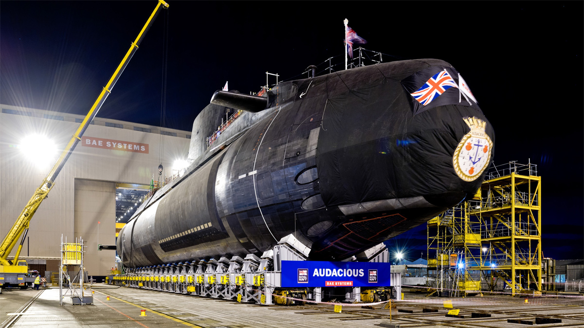 Image of Audacious on the shiplift after being carefully rolled out of the Devonshire Dock Hall