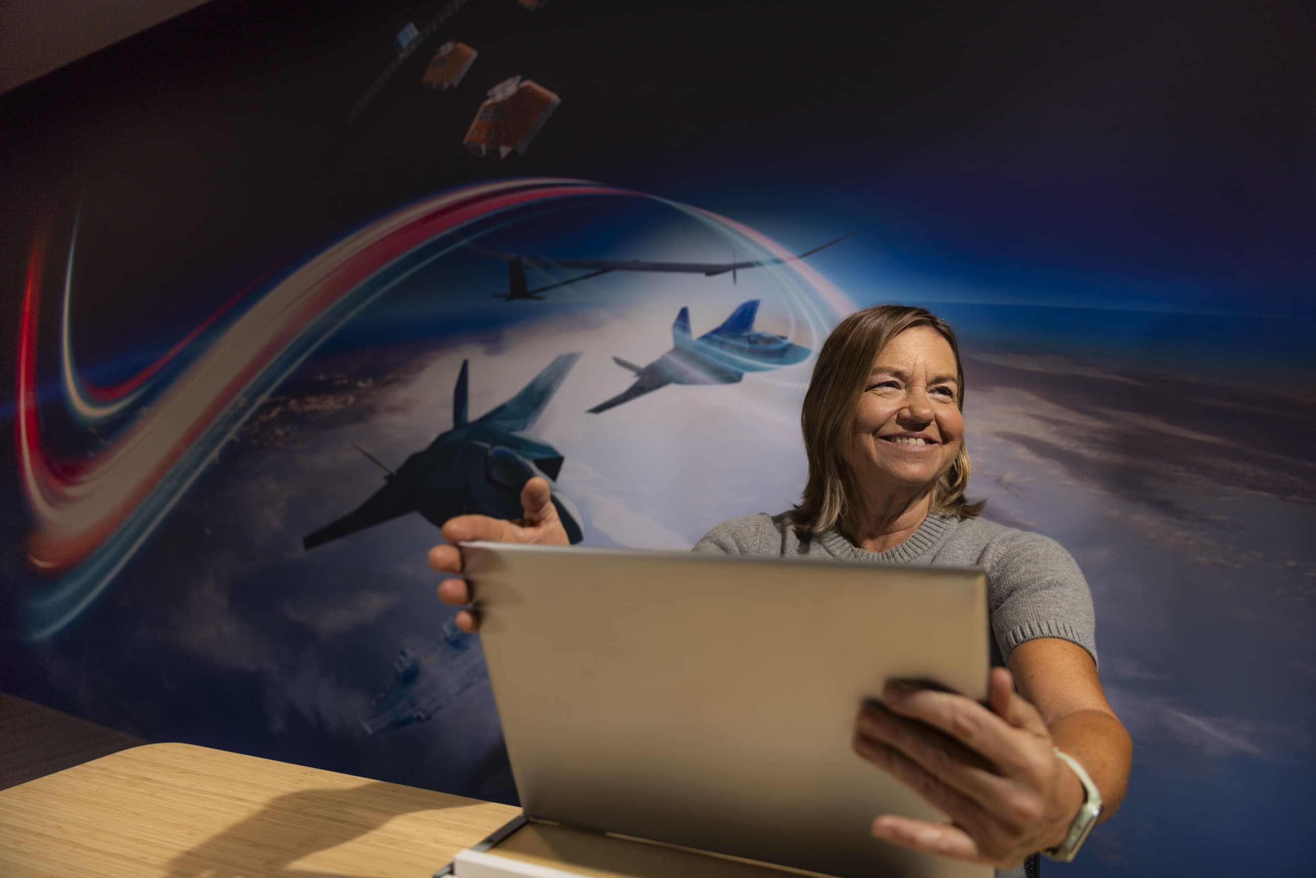 Woman looking up from screen