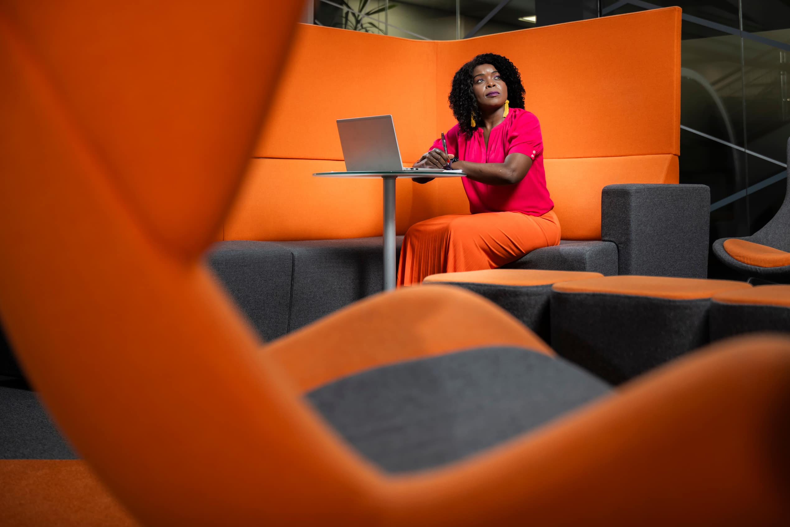 Woman working on a laptop in a sound proof office