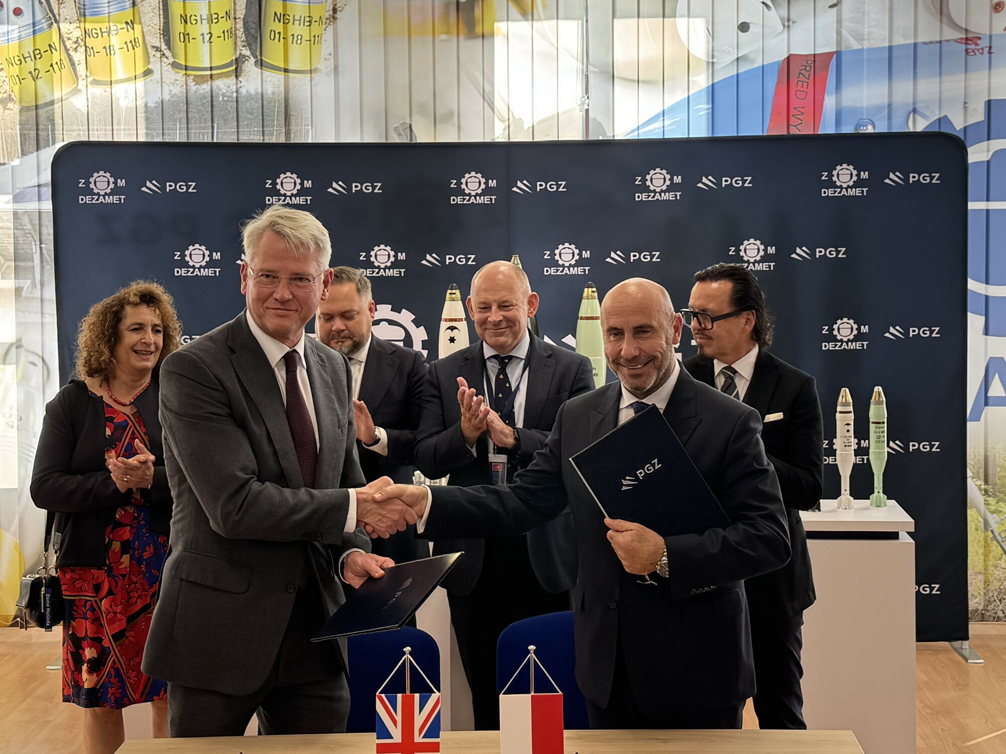 Image of contract signing for the Poland munitions partnership