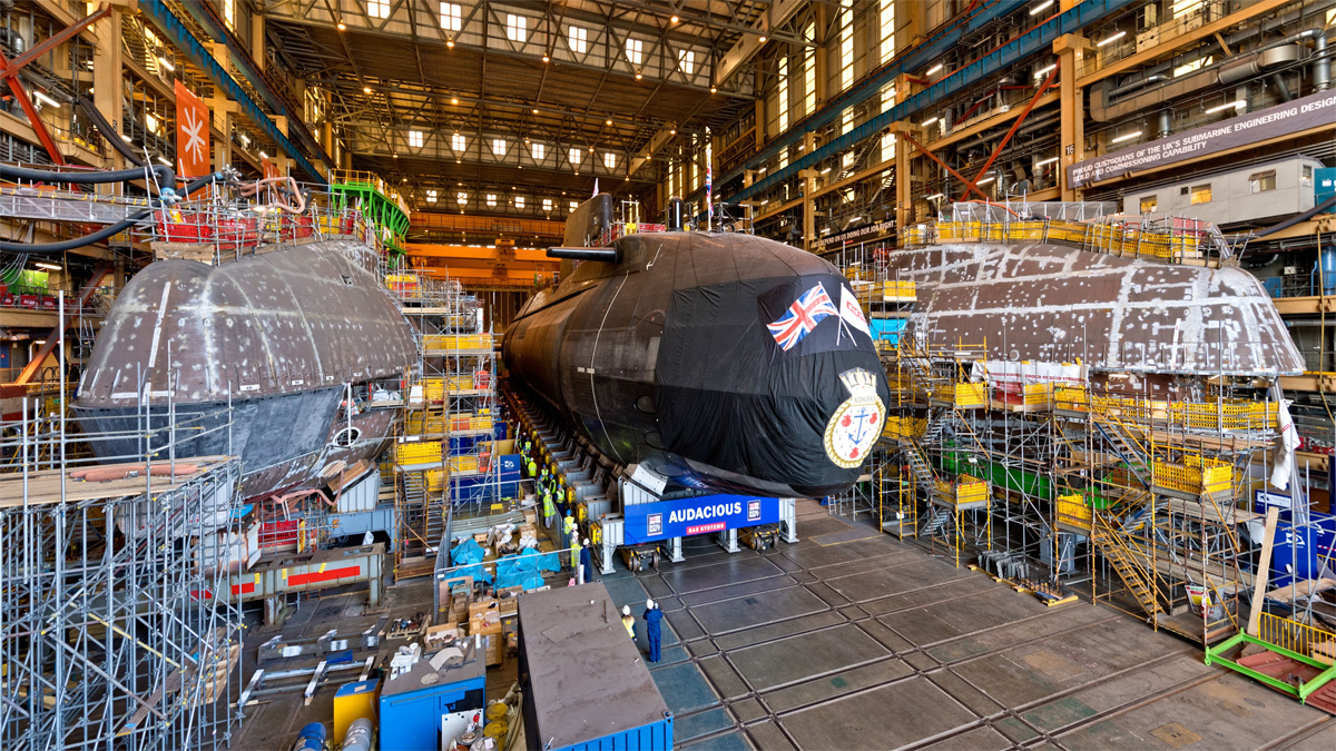 Image of Audacious lining up with her sister submarines Anson and Agamemnon as she prepares to leave the Devonshire Dock Hall