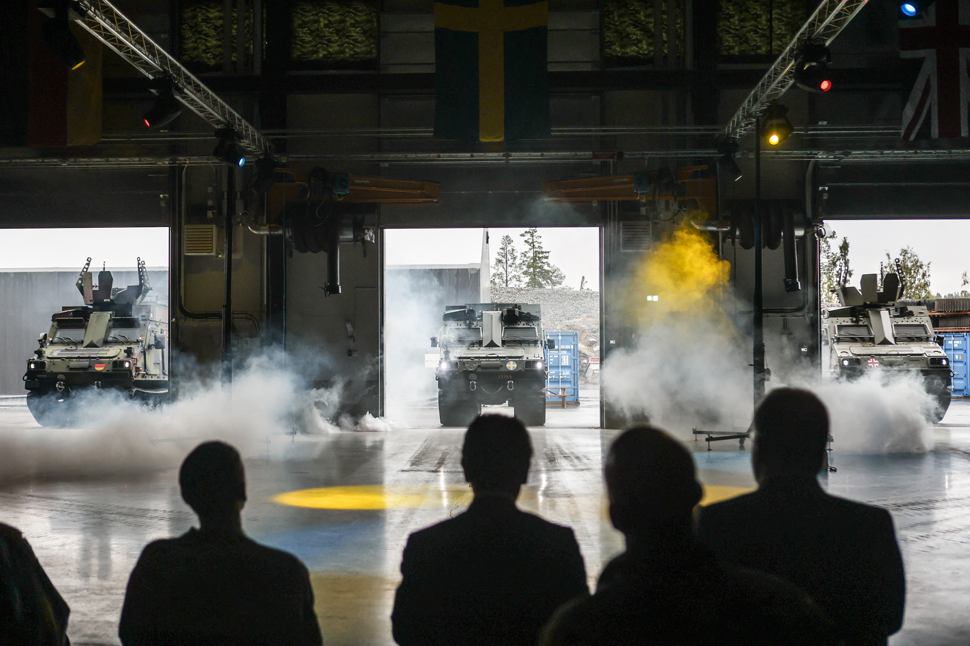 The first three BvS10 Armored Personnel Carriers for Sweden, Germany, and the United Kingdom making their entrance.