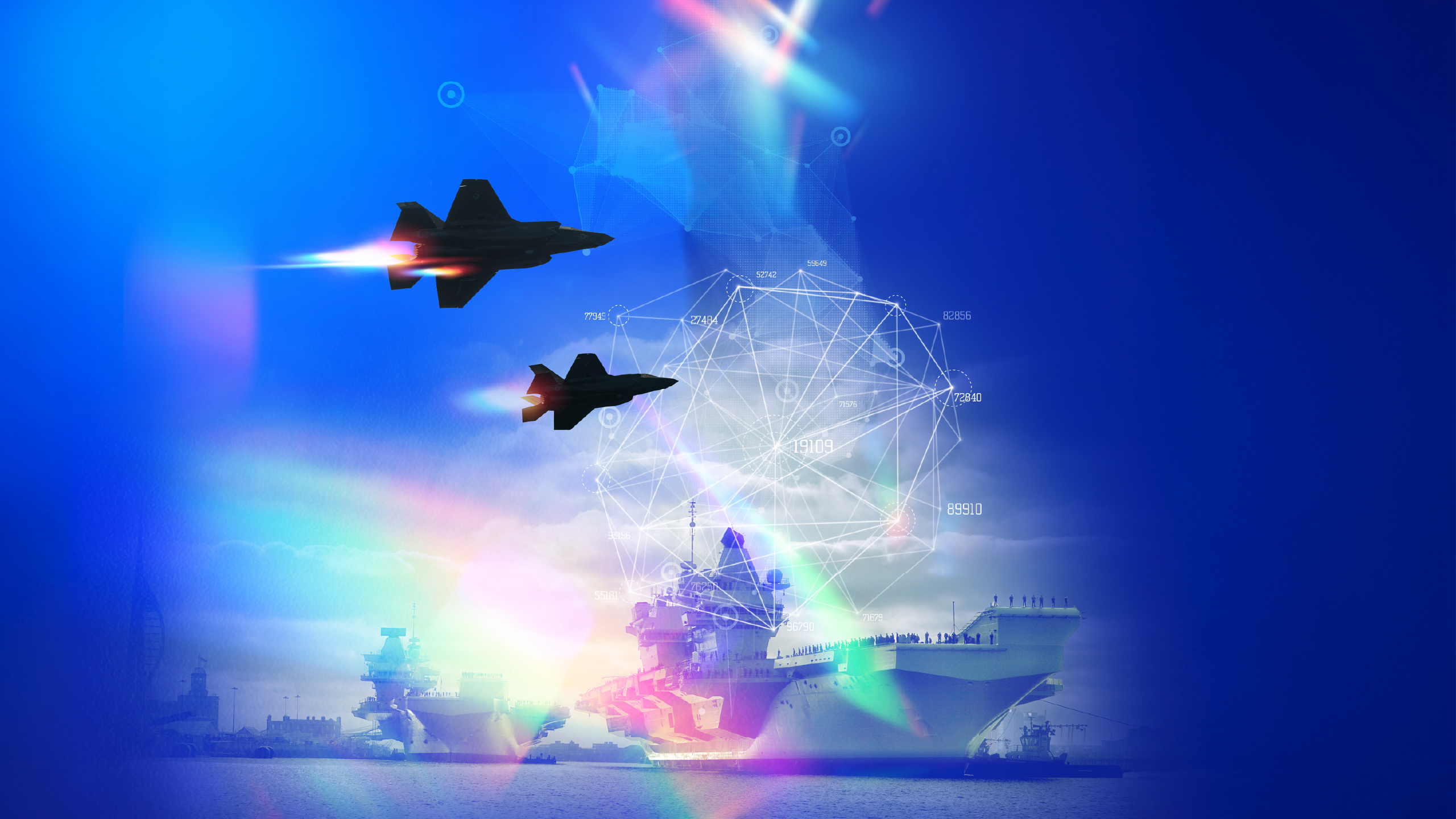 Aeroplanes fly above an aircraft carrier