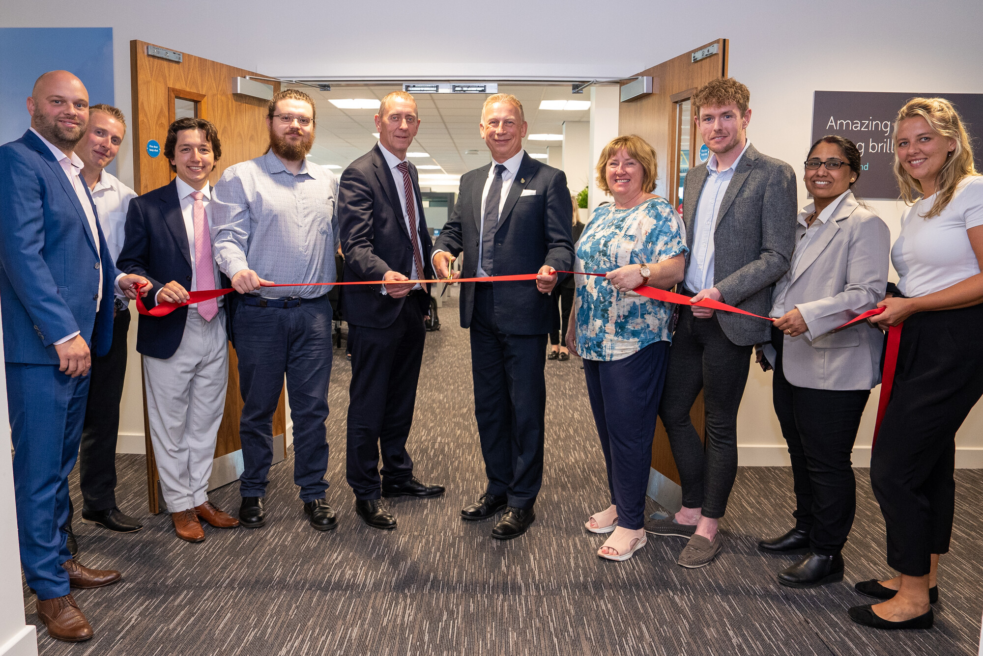 Image of ribbon cutting to open Coventry office