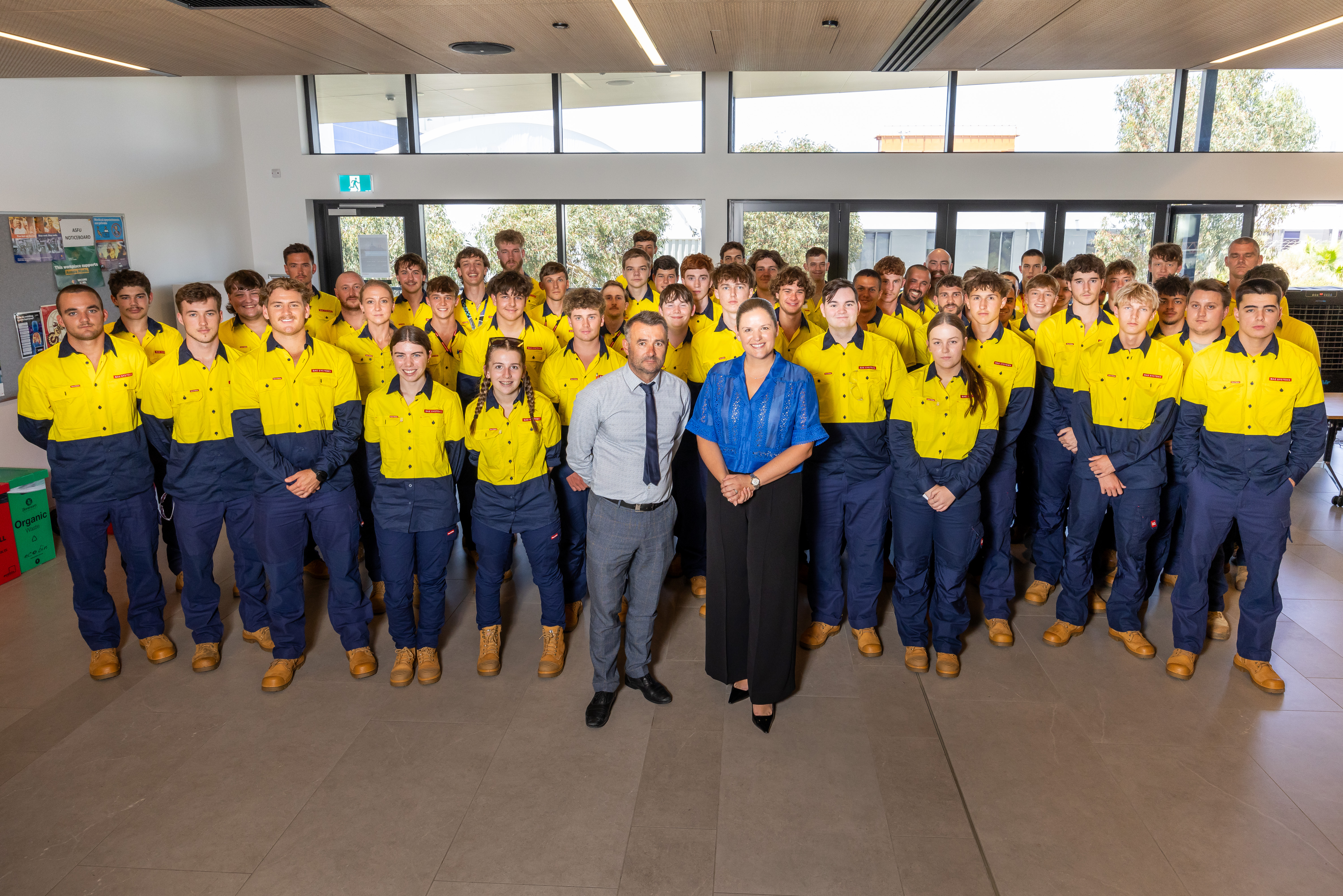 BAE Systems Australia’s Scott Robertson, Head of Supply Chain - Maritime Acquisition and Ema Saric, Head of People – Maritime, with this year’s intake of apprentices