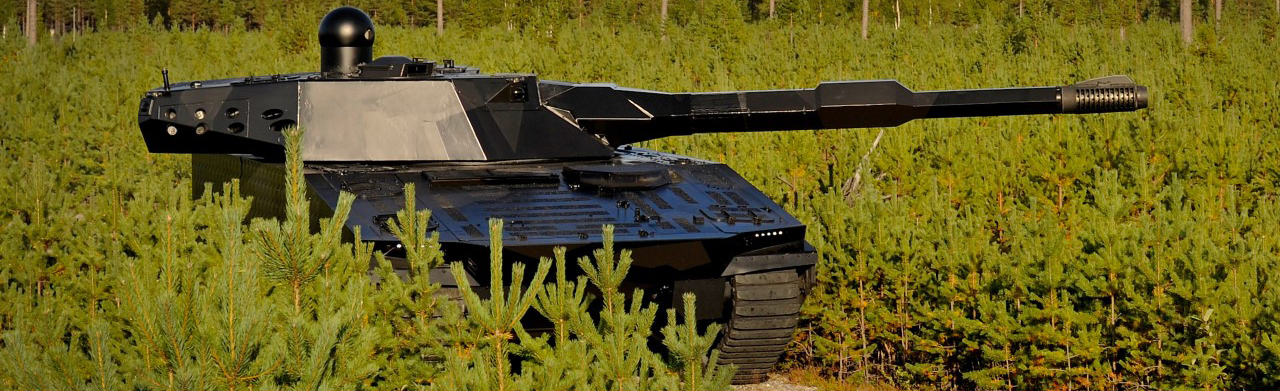 ADAPTIV CV90 in a field with tall grass
