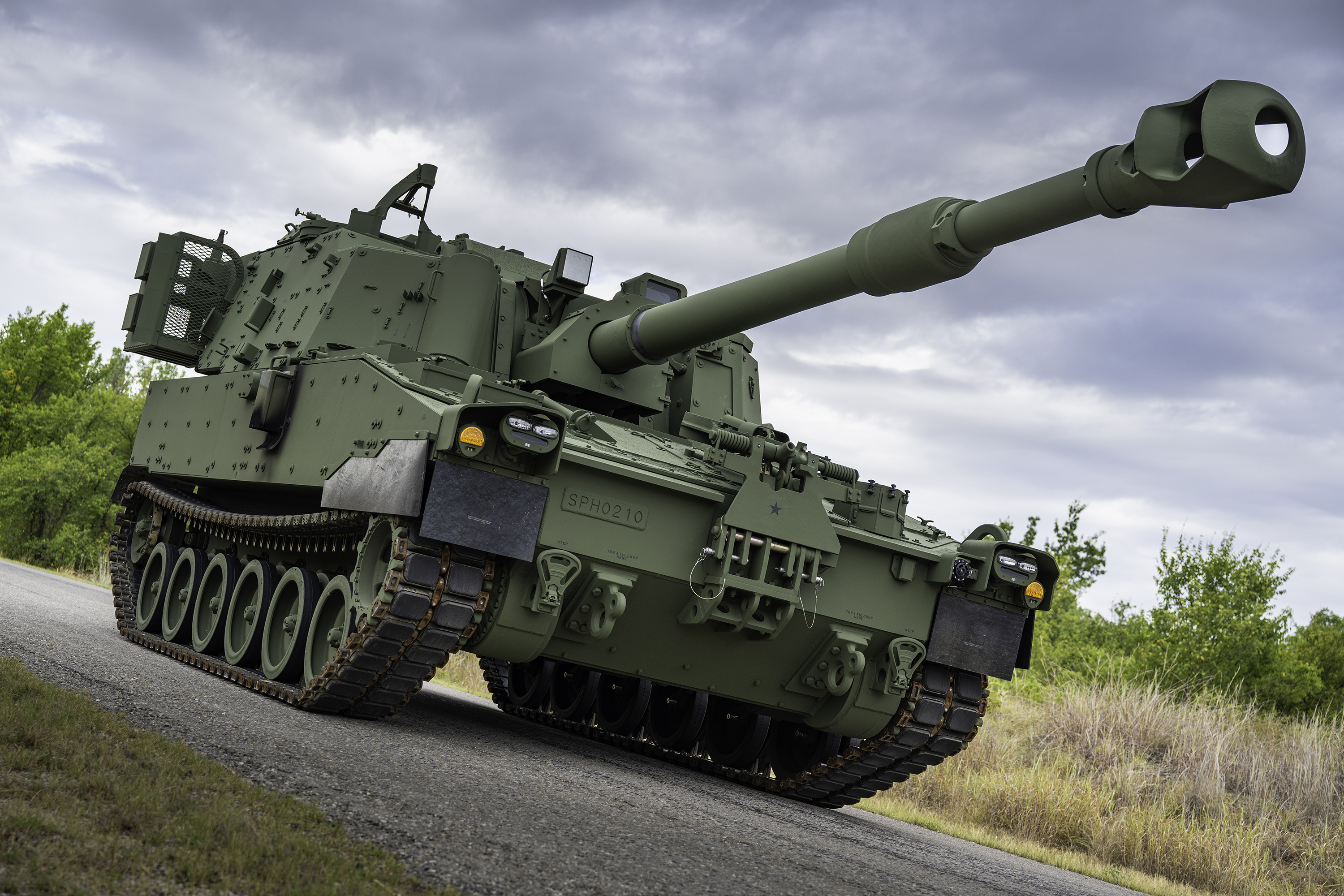 A close-up image of a green M109A7 vehicle