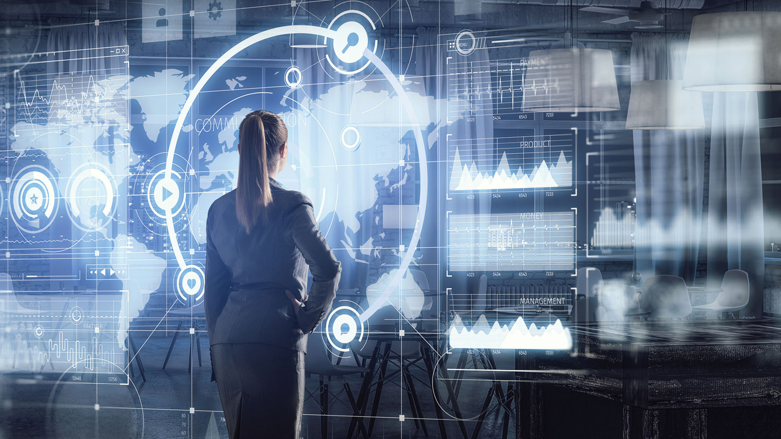 Woman at electronic performance dashboard, reflecting the vast amounts of data that our Resilient Ground Systems provide for better decision-making and more mission success. 
