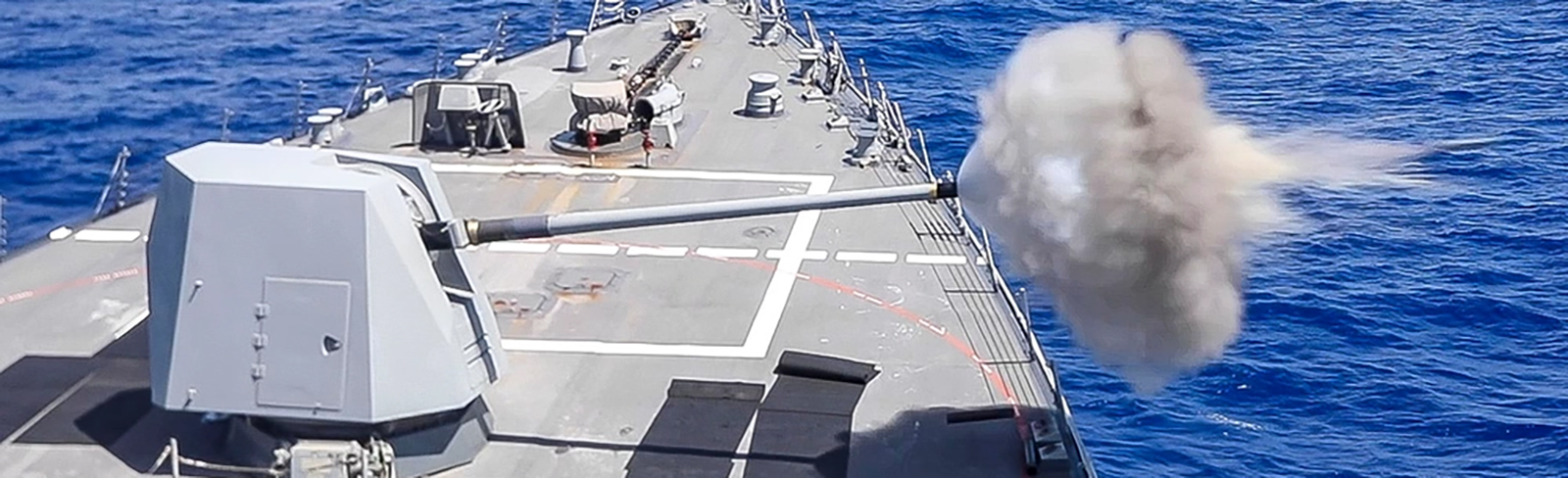 Arleigh Burke-class guided-missile destroyer USS John Finn (DDG 113) conducts a live-fire exercise of the Mk 34 Gun Weapons System.