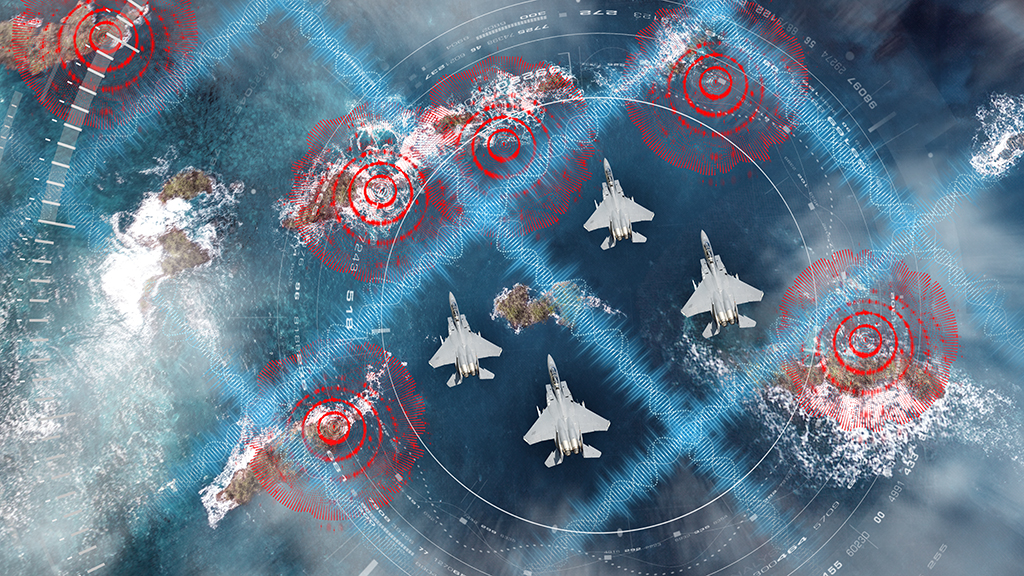 Overhead view of F/A-18 Hornets flying over decentralized adversaries as electromagnetic attack solutions by BAE Systems counter A2AD threats and degrade enemy defenses. 