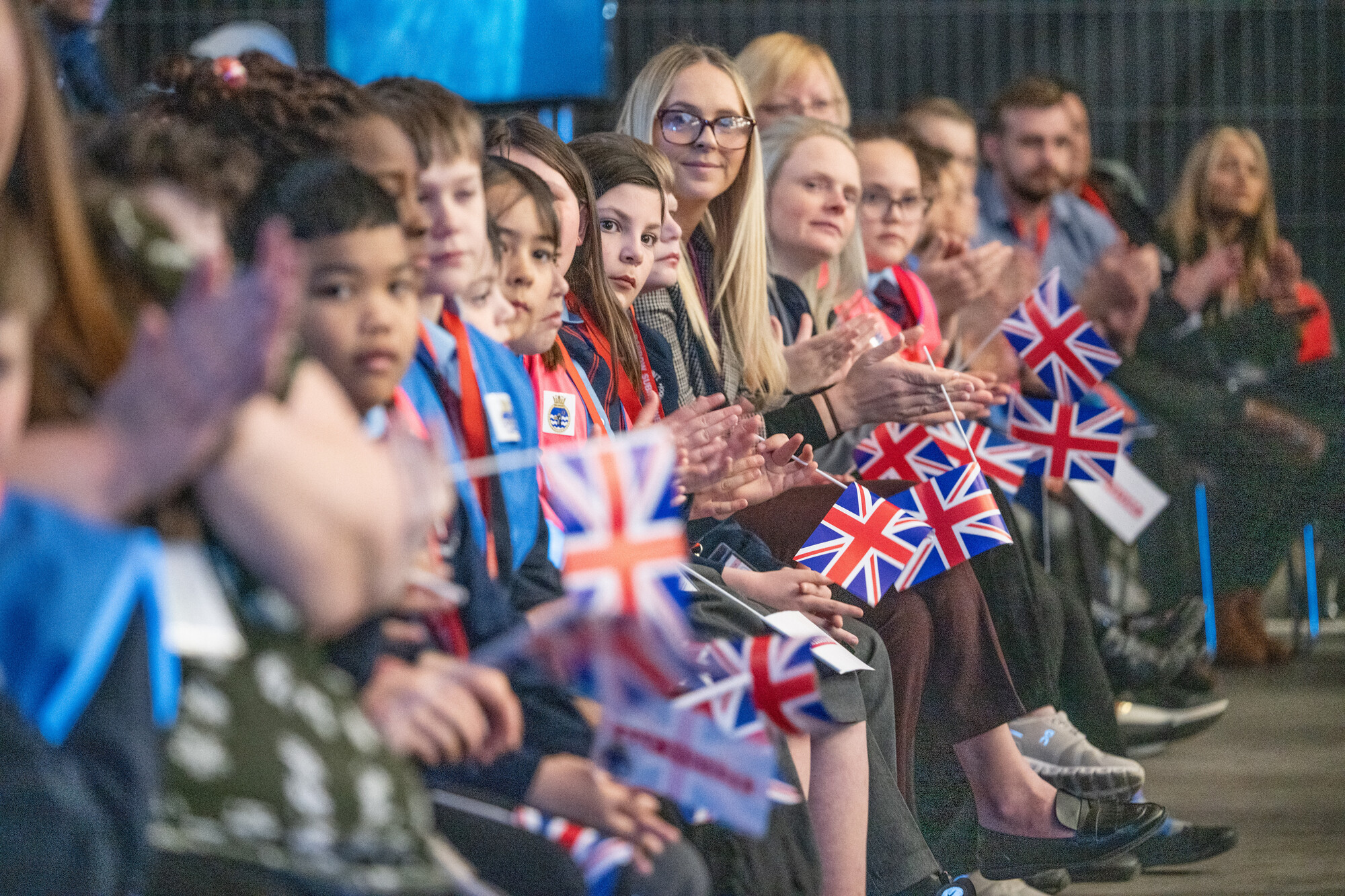 Image of employees and local children at keel laying