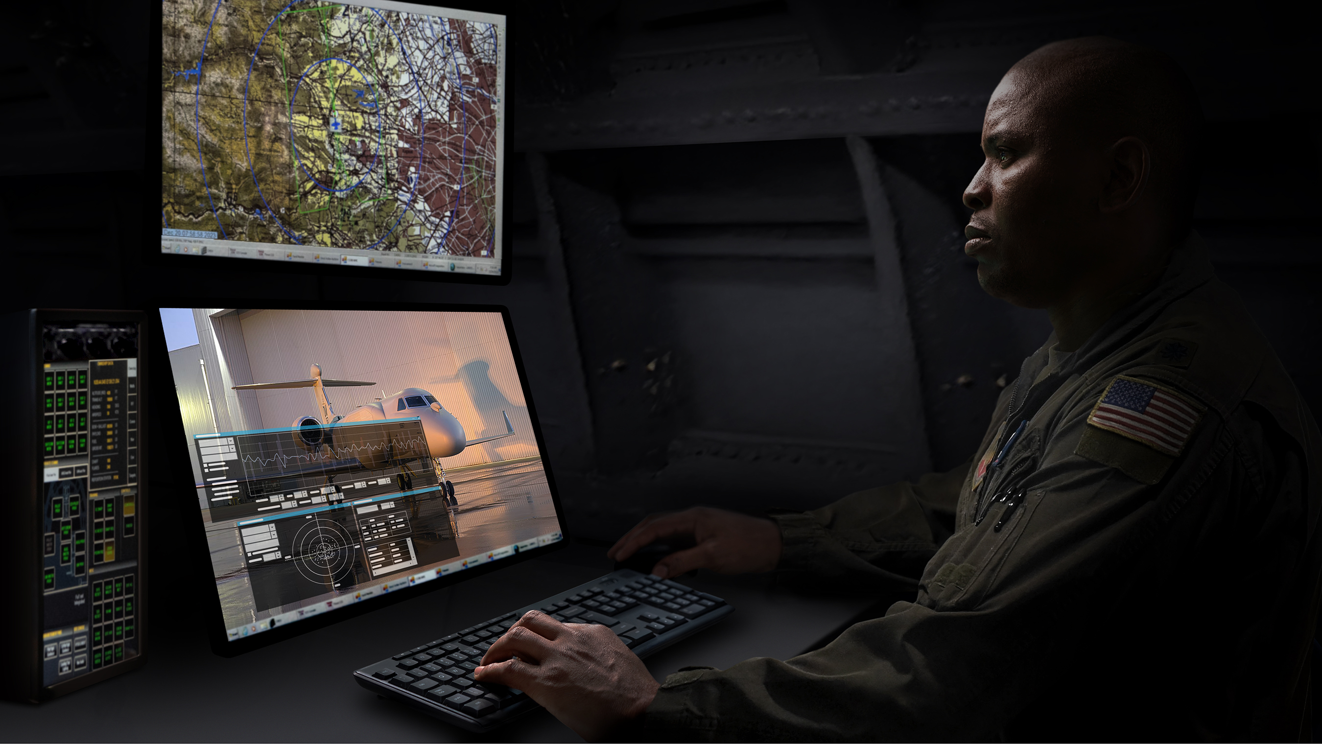 A warfighter sits in a darkened EA-37B aircraft, staring at monitors simulating dynamic real-world operations.