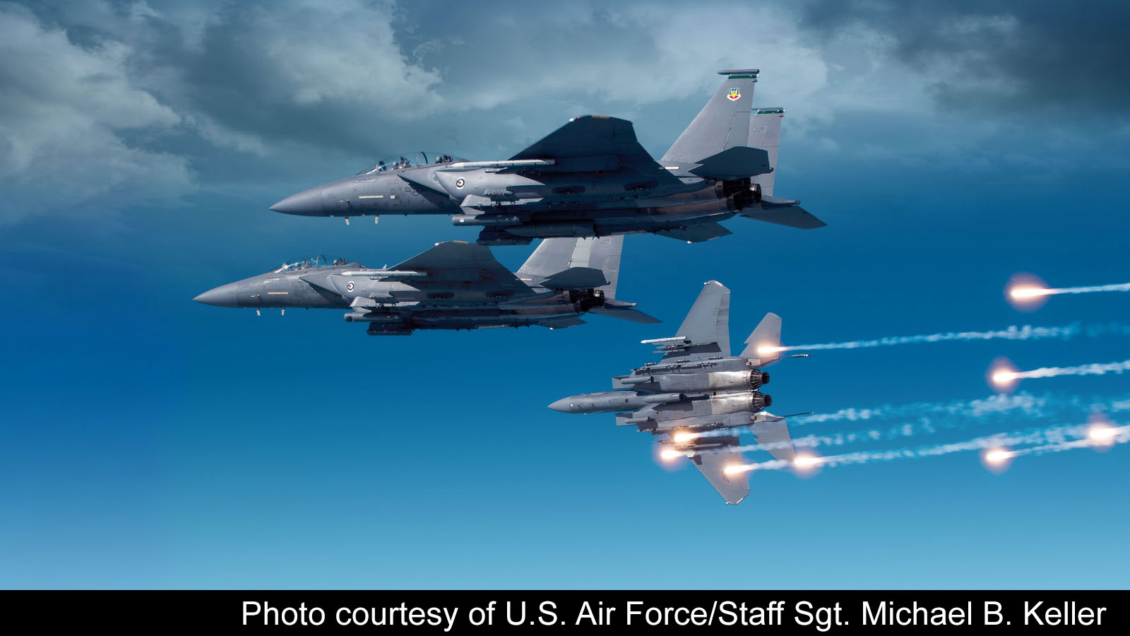 Close-up of USAF F-15s flying side-by-side, protected by the digital EW technology of BAE Systems' AN/ALQ-250 Eagle Passive Active Warning Survivability System (EPAWSS) to maximize mission success and survivability.